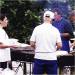 A photo of volunteers cooking up a sumtious BBQ at the park.